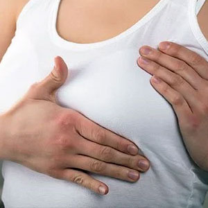 A lump or thickening in the breast or armpit